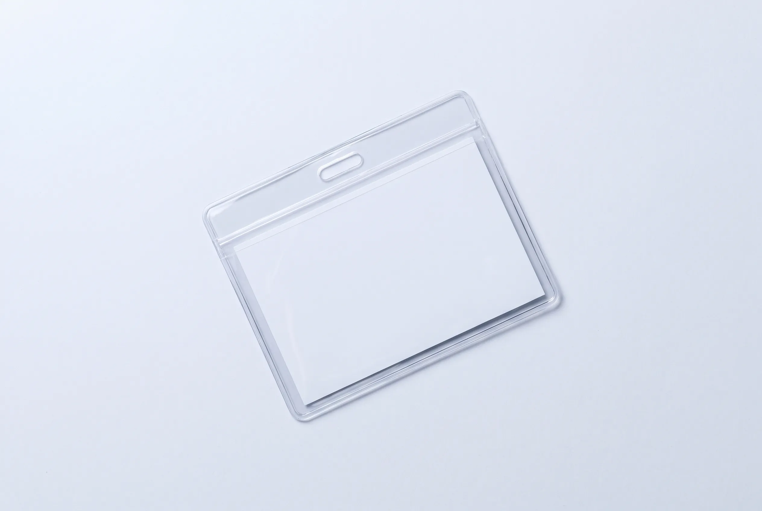A single clear PVC lanyard pouch in landscape orientation with a blank white insert.